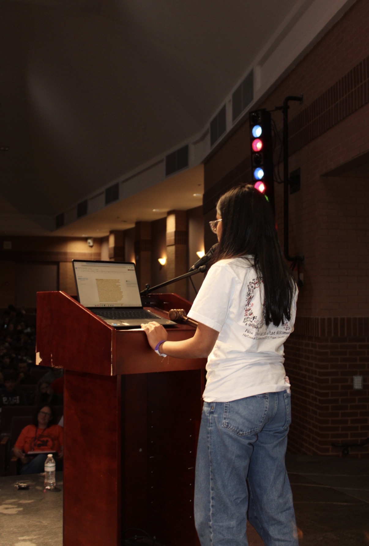 Speaking at podium